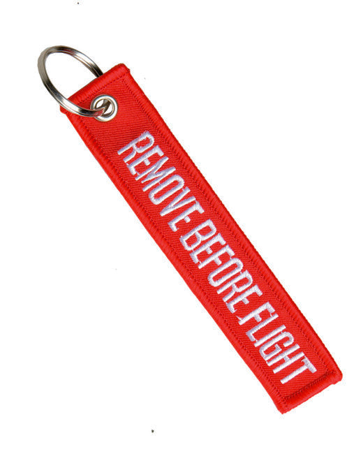 Mil-Tec "REMOVE BEFORE FLIGHT" privjesak za ključeve, crveni